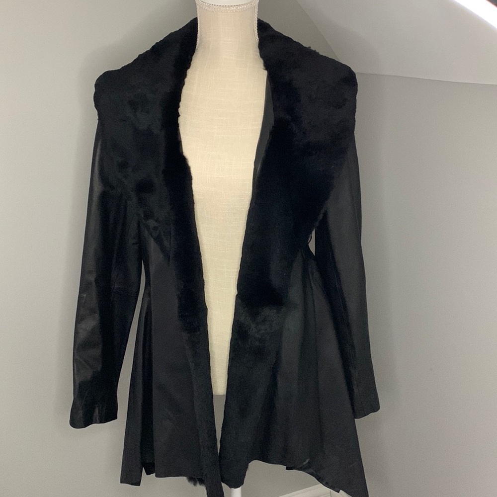 Women leather coat. As is condition missing the belt , very light used.